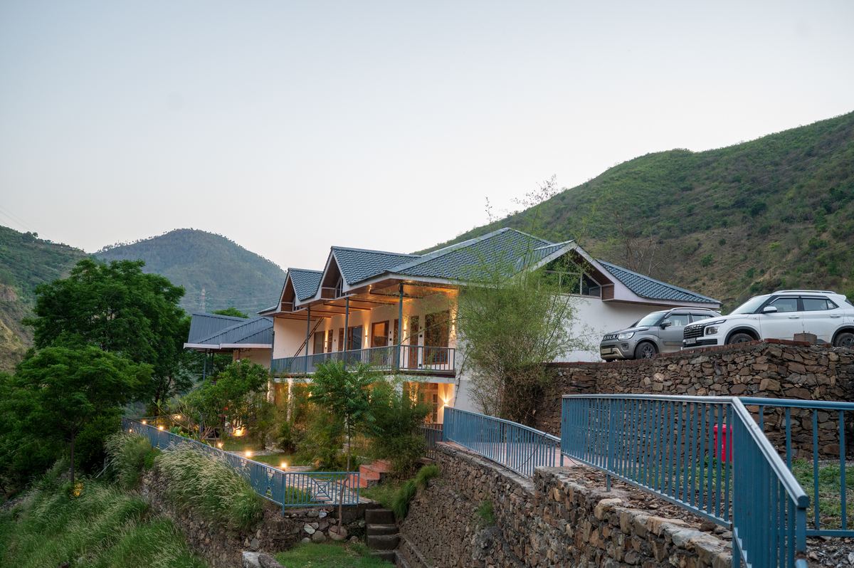 Full exterior of Giri River Retreat with Himalayan backdrop