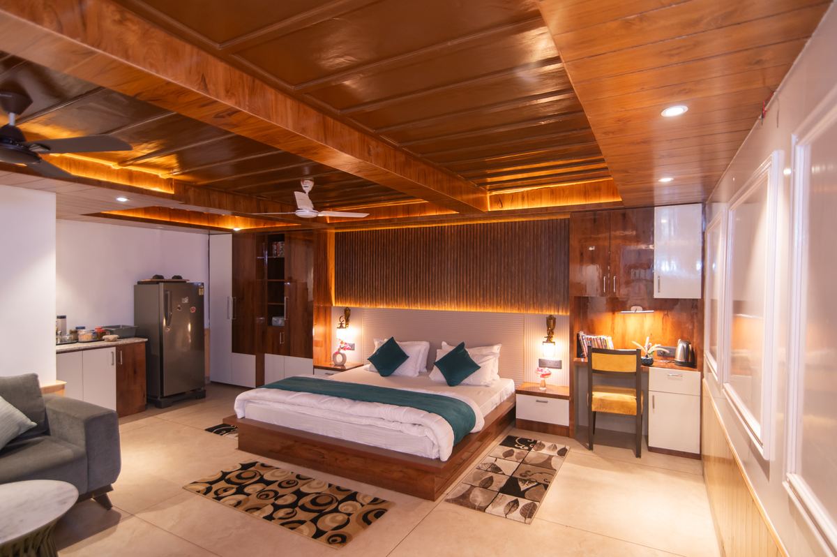 Suite with lounge area and wood accent walls