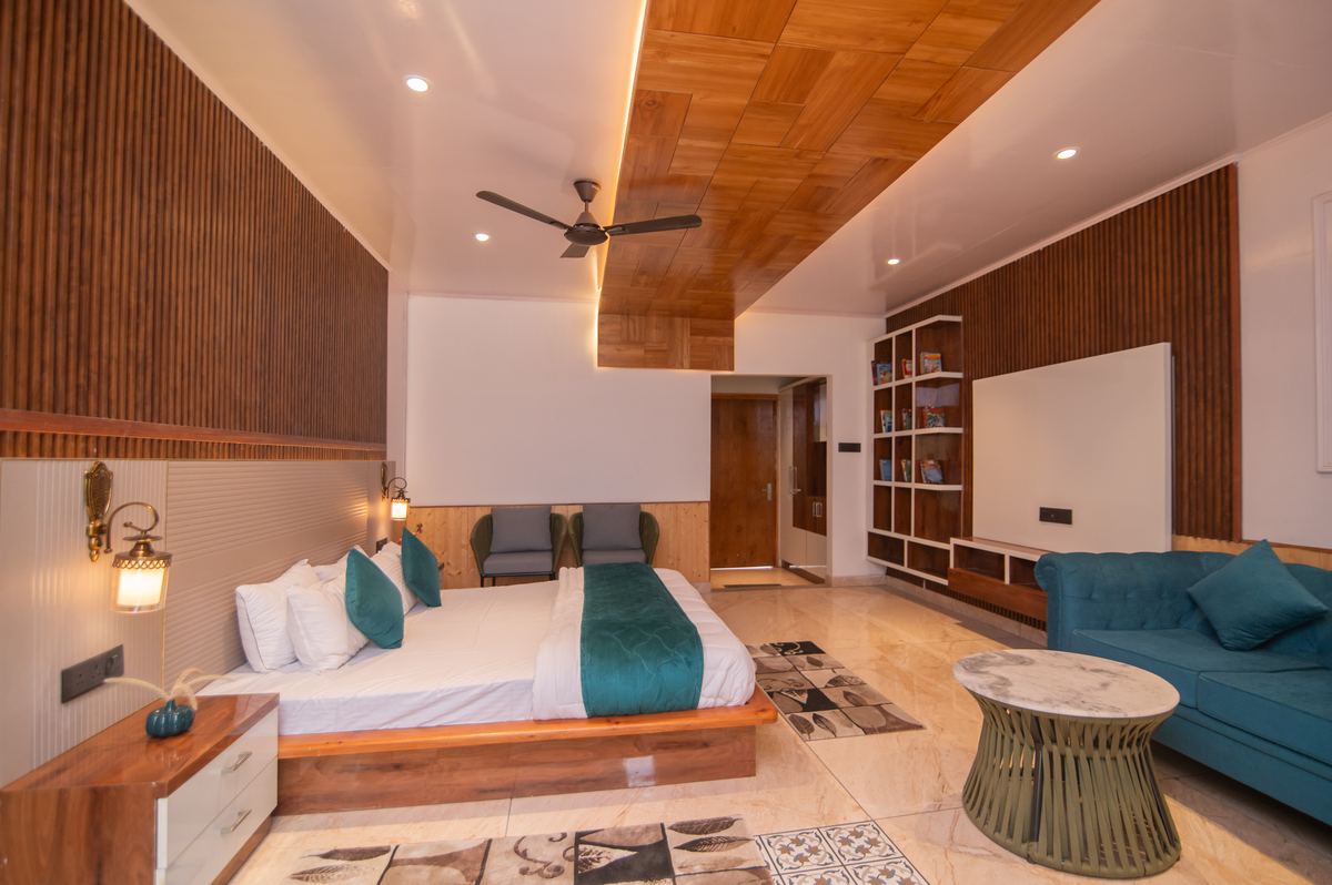 Room with teal sofa and marble coffee table